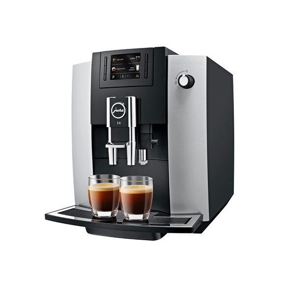 Máquina de café espresso con dos tazas llenas.